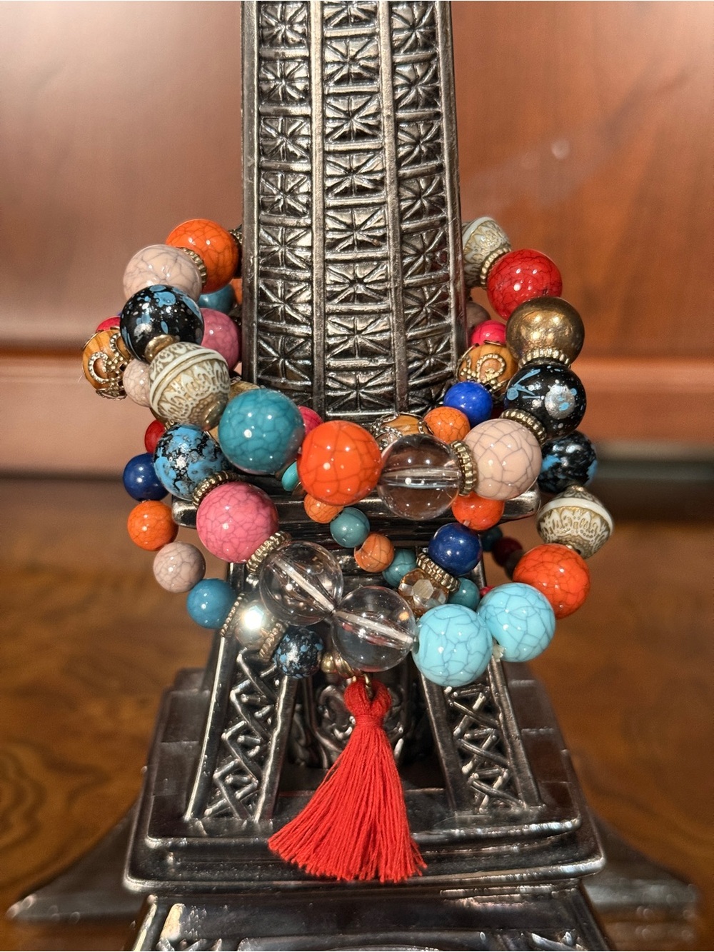Multi-Strand Colorful Beaded Bracelet with Red Tassel